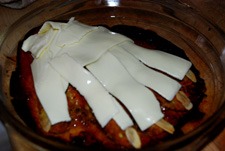 Poner queso por encima