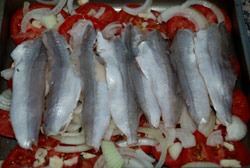 Tapar con capa de tomates